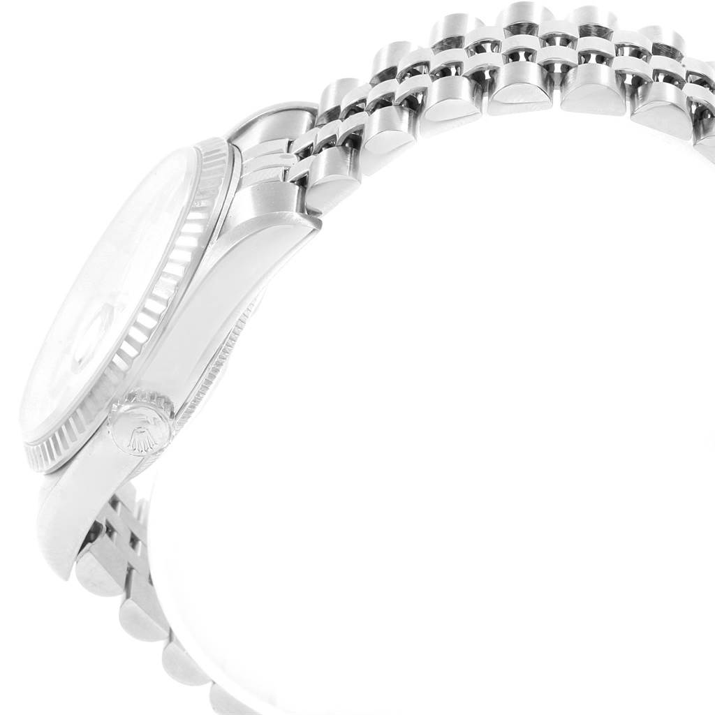 The image shows a side view of a Rolex Datejust 16234 Men's Stainless Steel Blue Dial 16234 Men's Stainless Steel Blue Dial watch, focusing on the case, crown, and partially visible bracelet.