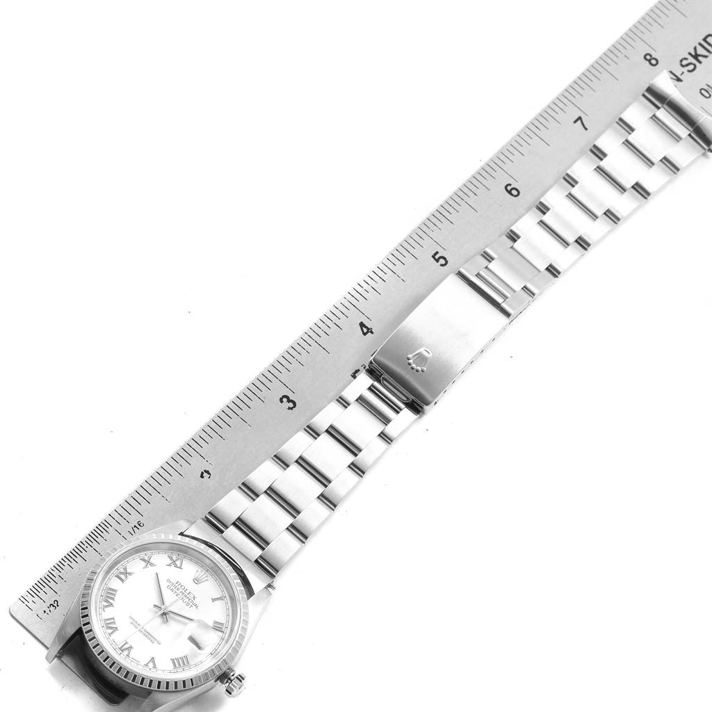 The image shows the Rolex Datejust 16220 Men's Stainless Steel White Dial 16220 Men's Stainless Steel White Dial watch laid flat, with a ruler measuring the bracelet and the clasp visible.