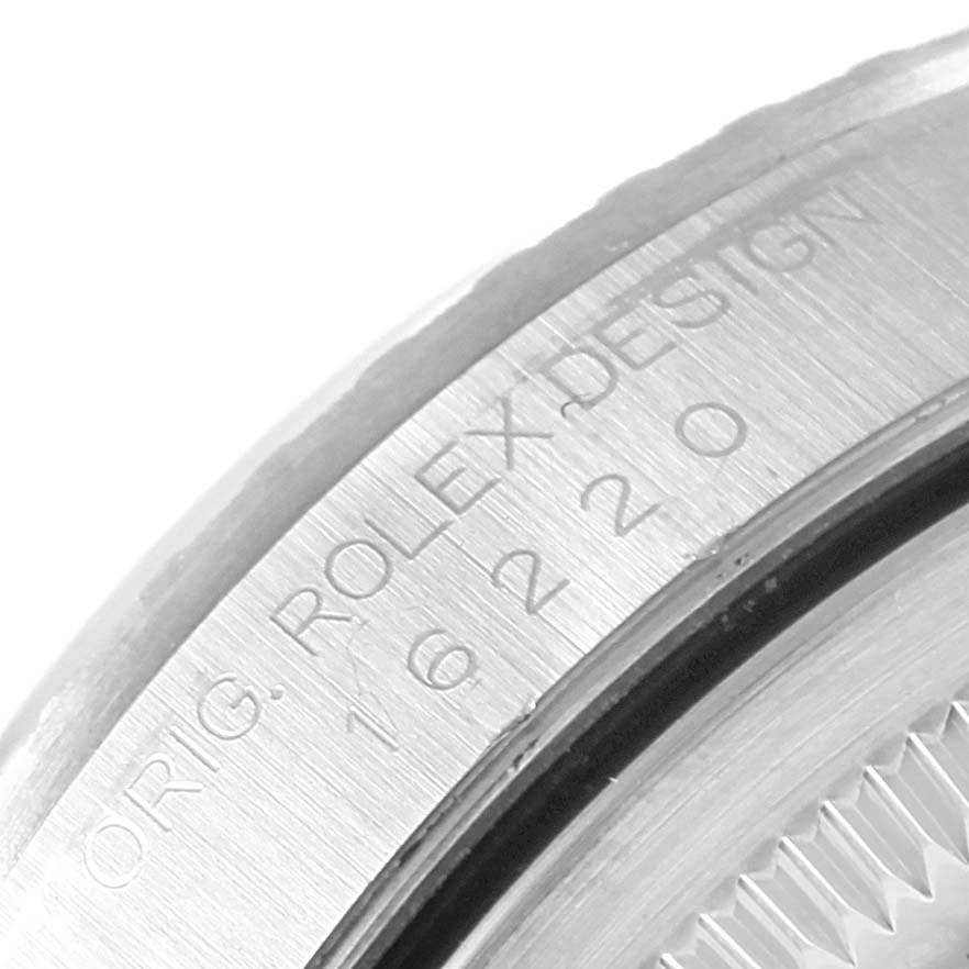 The image shows a close-up of the side of a Rolex Datejust 16220 Men's Stainless Steel White Dial 16220 Men's Stainless Steel White Dial model, focusing on the engraved text on the case.