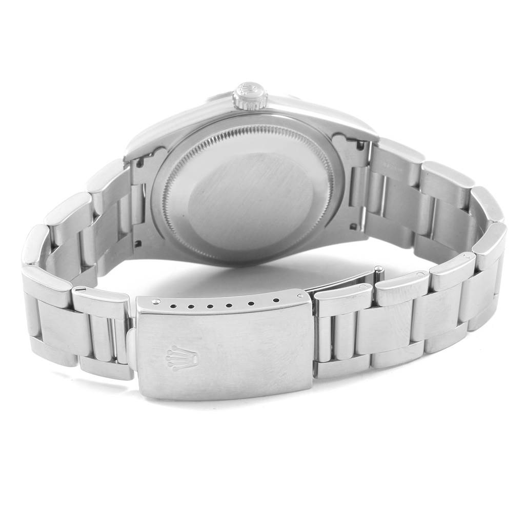 The image shows the back view of a Rolex Datejust 16220 Men's Stainless Steel White Dial 16220 Men's Stainless Steel White Dial watch, focusing on the case back and the bracelet with its clasp.