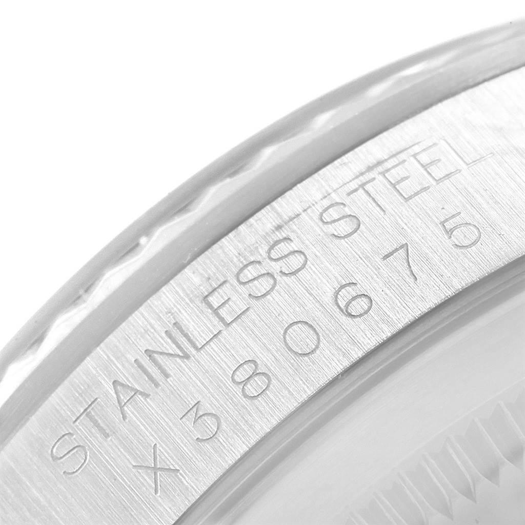 This image shows a close-up of the serial number and "Stainless Steel" engraving on the bezel of a Rolex Datejust 16234 Men's Stainless Steel Silver Dial 16234 Men's Stainless Steel Silver Dial watch.