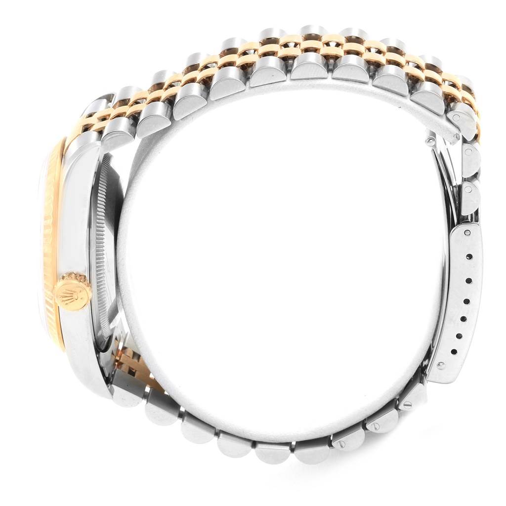 This image shows a side angle of a Rolex Datejust 16233 Men's Steel and Gold (two tone) Mother of Pearl Dial 16233 Men's Steel and Gold (two tone) Mother of Pearl Dial watch, focusing on the crown, bezel, and portion of the bracelet.