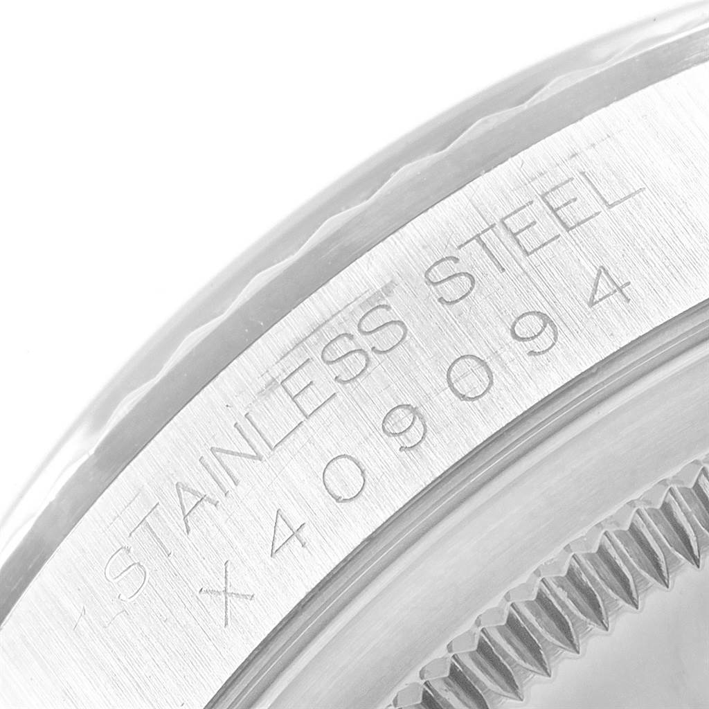 This image shows a close-up of the serial number engraved on the stainless steel side of a Rolex Datejust 16234 Men's Stainless Steel Blue Dial 16234 Men's Stainless Steel Blue Dial watch.