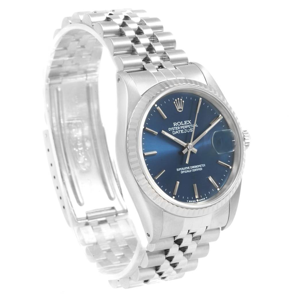The image shows a Rolex Datejust 16234 Men's Stainless Steel Blue Dial 16234 Men's Stainless Steel Blue Dial watch at a three-quarter angle, highlighting the face, bezel, and Jubilee bracelet.