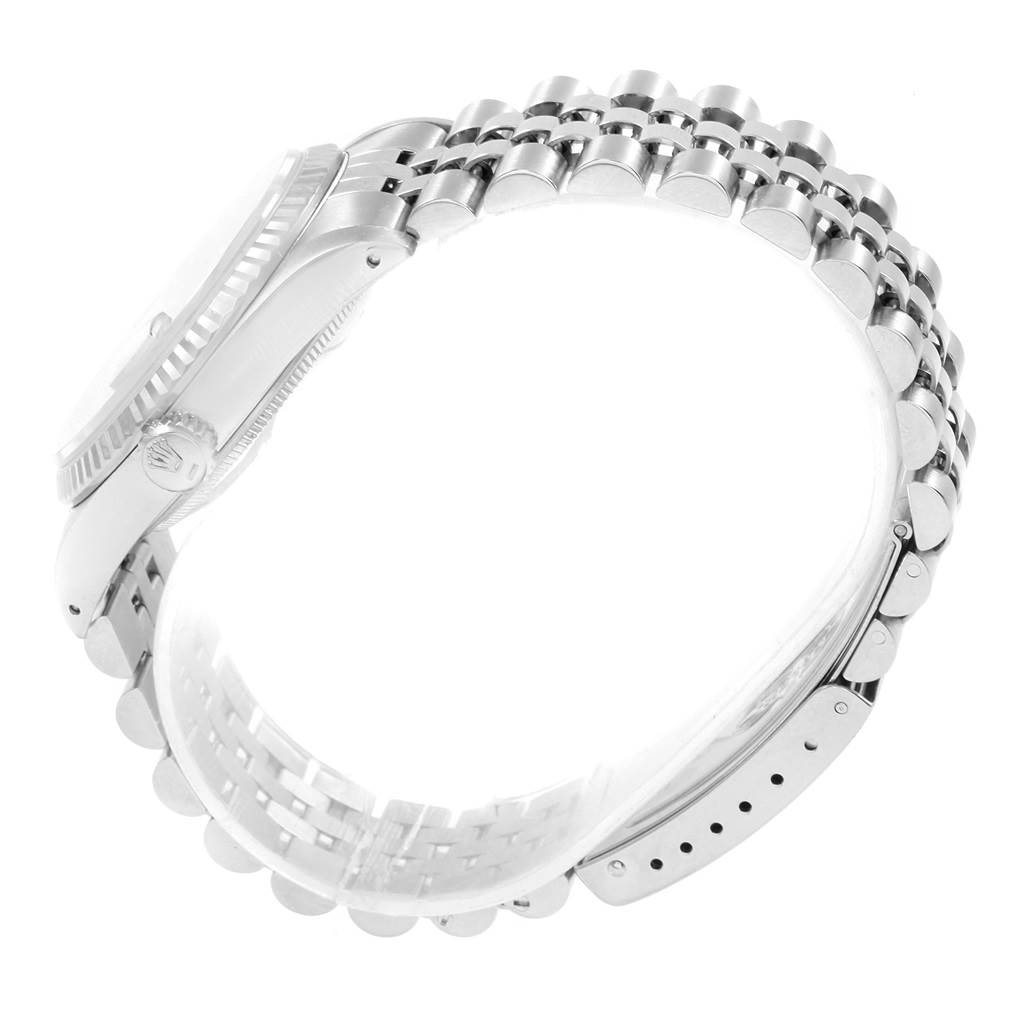 The image shows a side view of the Rolex Datejust 16234 Men's Stainless Steel Blue Dial 16234 Men's Stainless Steel Blue Dial watch, focusing on the crown, case, and the Jubilee bracelet.