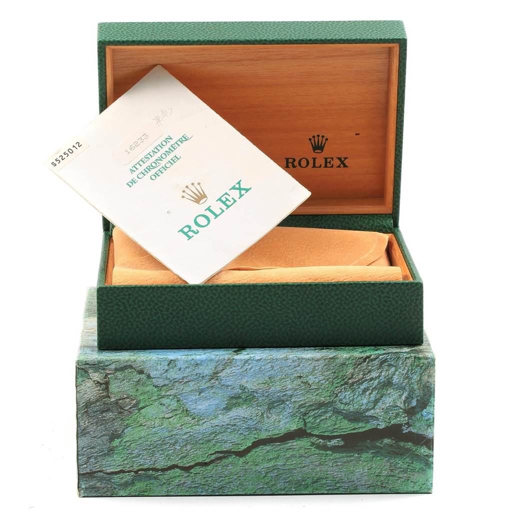 This image shows an open Rolex Datejust 16233 Men's Steel and Gold (two tone) Beige Dial 16233 Men's Steel and Gold (two tone) Beige Dial box with documentation inside.