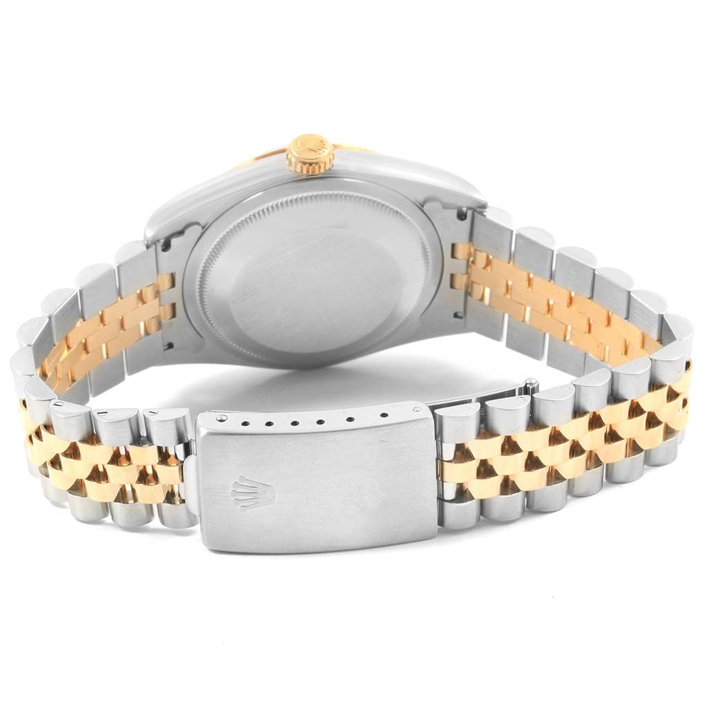 A Rolex Datejust 16233 Men's Steel and Gold (two tone) Beige Dial 16233 Men's Steel and Gold (two tone) Beige Dial watch is shown from the rear, highlighting the case back, crown, and two-tone jubilee bracelet with clasp.