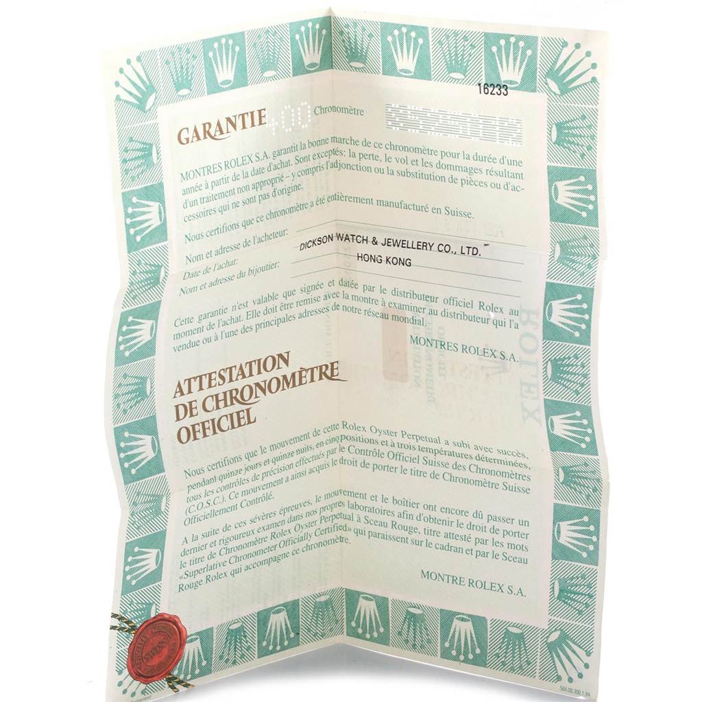 This image shows a folded warranty and official chronometer certificate for a Rolex Datejust 16233 Men's Steel and Gold (two tone) Beige Dial 16233 Men's Steel and Gold (two tone) Beige Dial model.