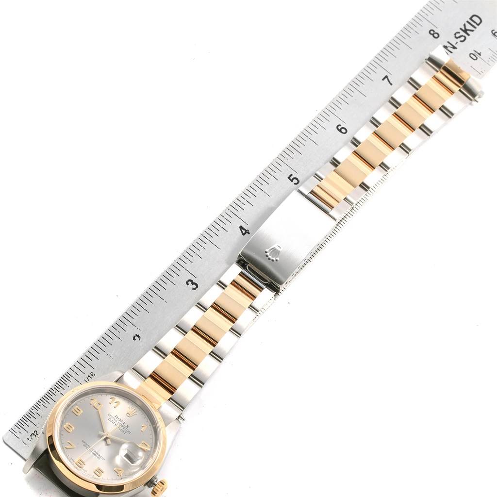 The image shows a Rolex Datejust 16203 Men's Steel and Gold (two tone) Grey Dial 16203 Men's Steel and Gold (two tone) Grey Dial watch laid flat with a ruler measuring its band length.