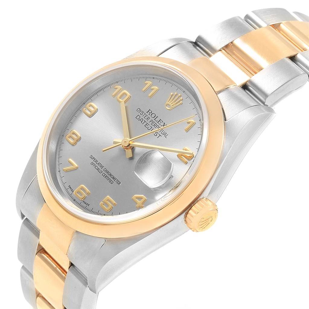 The image shows a Rolex Datejust 16203 Men's Steel and Gold (two tone) Grey Dial 16203 Men's Steel and Gold (two tone) Grey Dial watch at an angle highlighting its stainless steel and gold case, bezel, dial, and oyster bracelet.