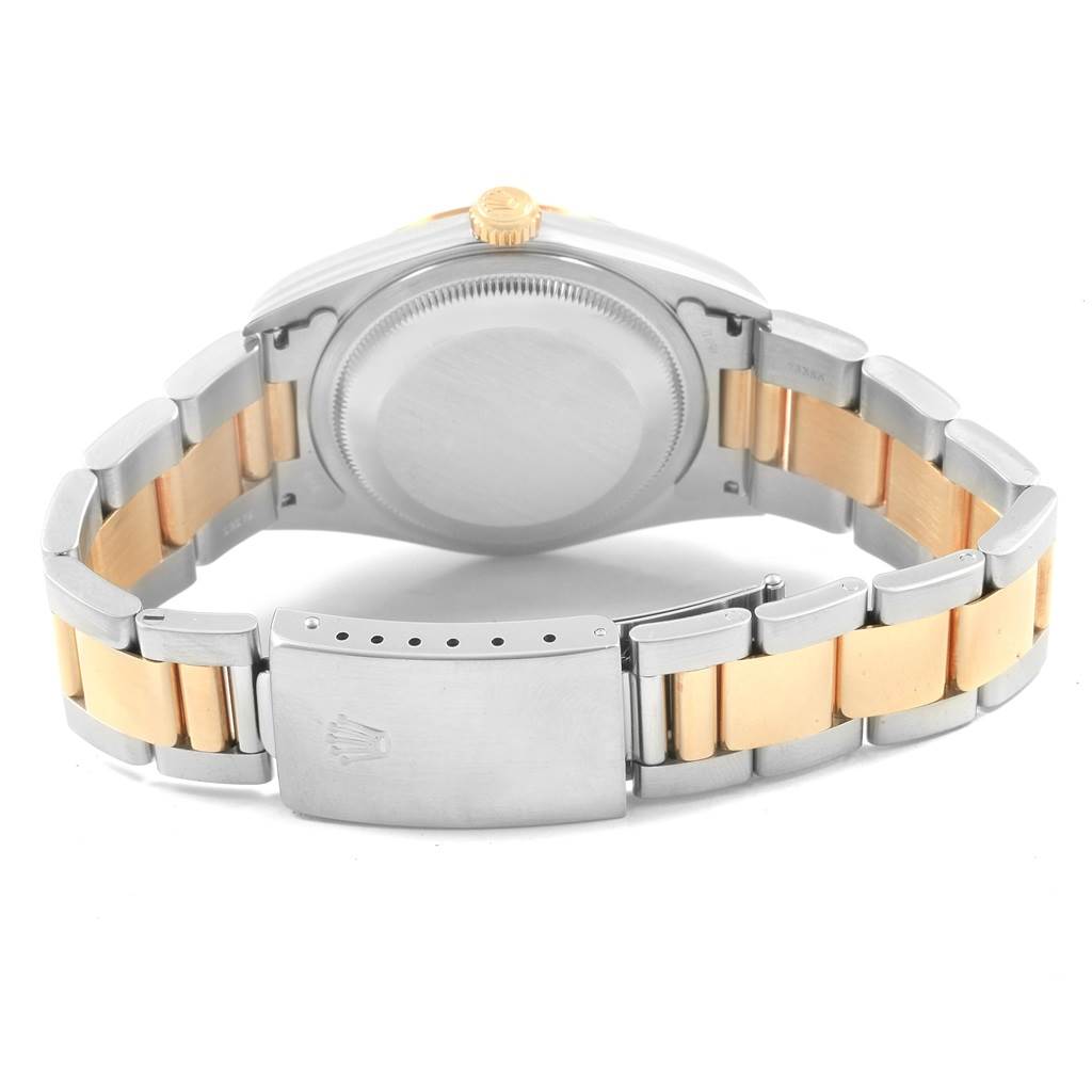 This image shows the backside of a Rolex Datejust 16203 Men's Steel and Gold (two tone) Grey Dial 16203 Men's Steel and Gold (two tone) Grey Dial watch, highlighting its clasp, case back, and two-tone bracelet.