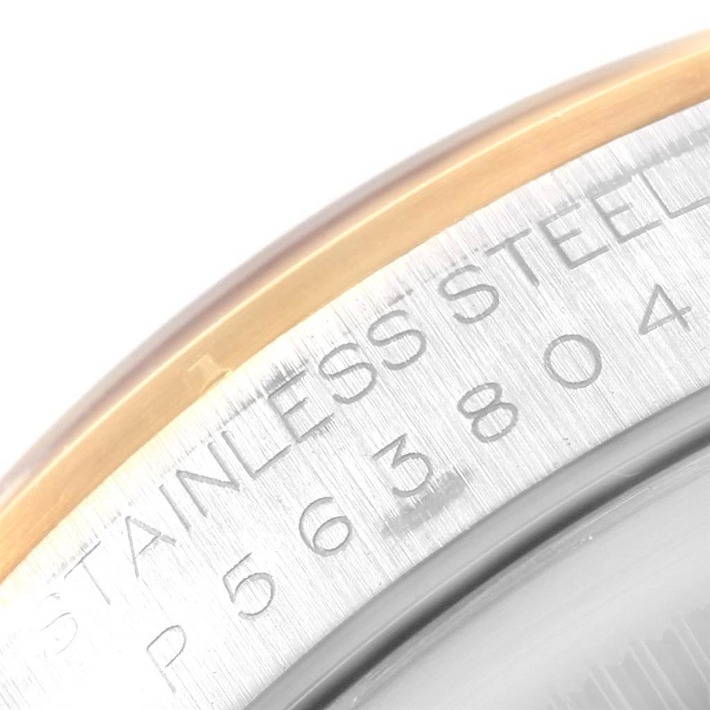 This image shows a partial close-up of the bezel and case of a Rolex Datejust 16203 Men's Steel and Gold (two tone) Grey Dial 16203 Men's Steel and Gold (two tone) Grey Dial watch, highlighting the serial number and material.