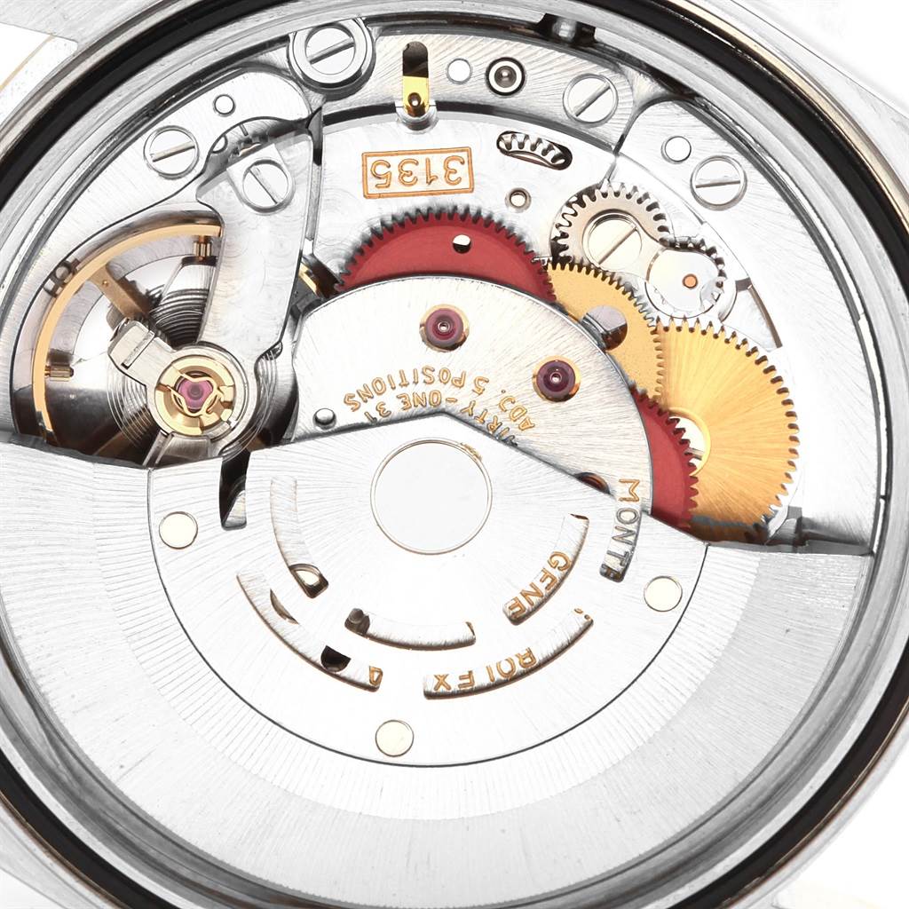 The image shows the inner mechanical movement of a Rolex Datejust 16233 Men's Steel and Gold (two tone) Champagne Dial 16233 Men's Steel and Gold (two tone) Champagne Dial watch, viewed from the back with various gears and components visible.