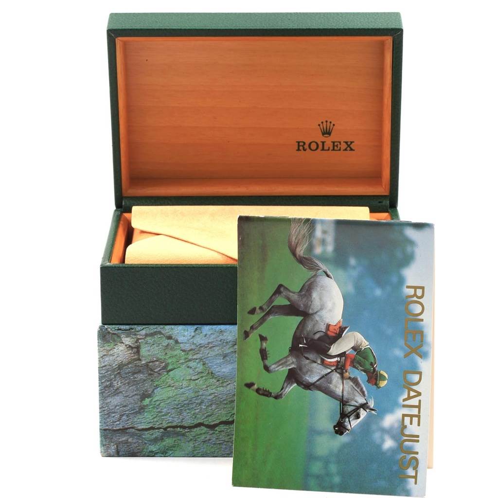 The image shows a Rolex Datejust 16233 Men's Steel and Gold (two tone) Champagne Dial 16233 Men's Steel and Gold (two tone) Champagne Dial model watch box, with the top open and a brochure featuring a horse and rider.
