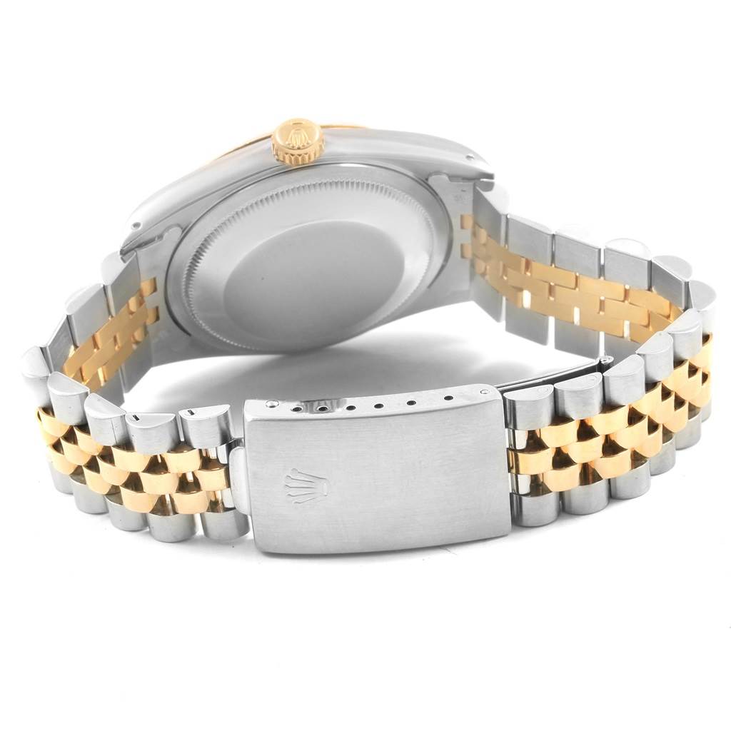 The image shows the back of a Rolex Datejust 16233 Men's Steel and Gold (two tone) Champagne Dial 16233 Men's Steel and Gold (two tone) Champagne Dial watch focusing on the clasp, bracelet, and case back.