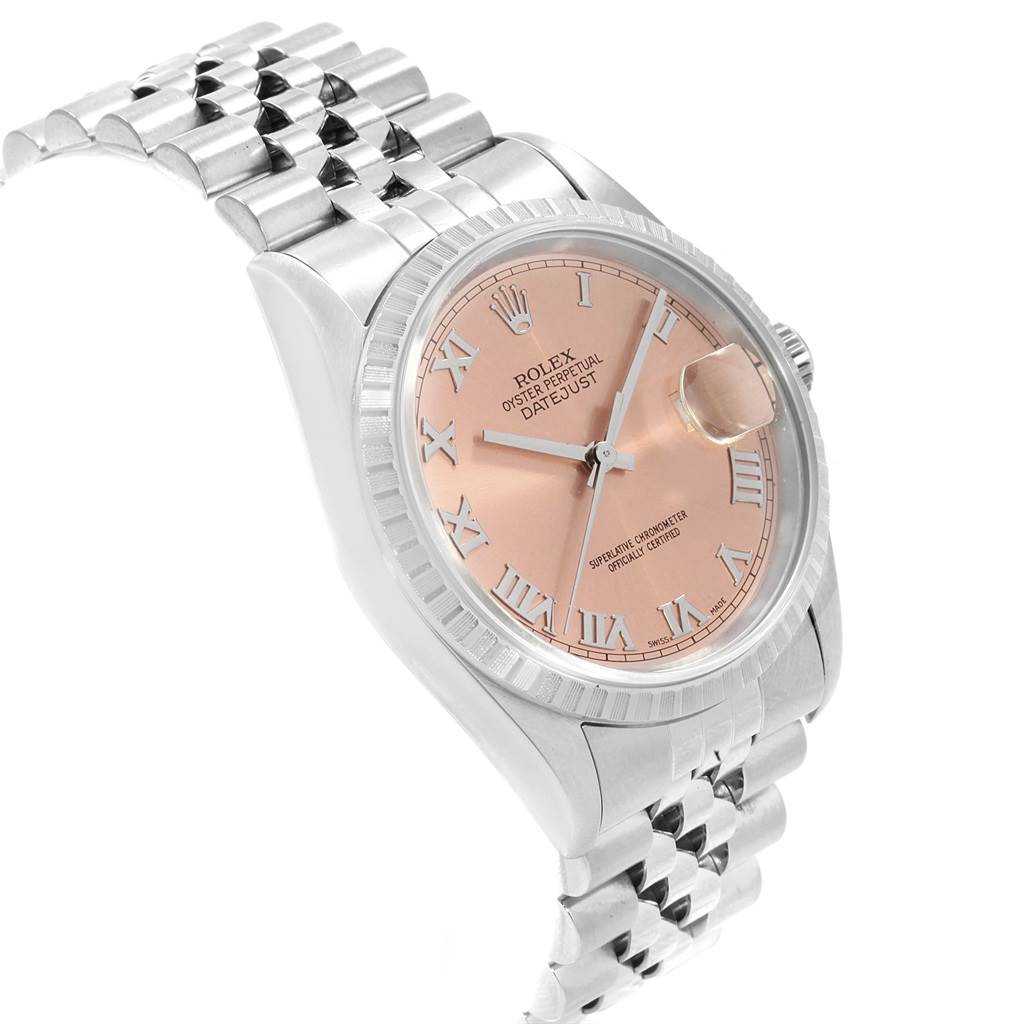 This Rolex Datejust 16220 Men's Stainless Steel Pink Dial 16220 Men's Stainless Steel Pink Dial watch is shown at an angled view, highlighting the pink dial, Roman numerals, cyclops lens, and Jubilee bracelet.