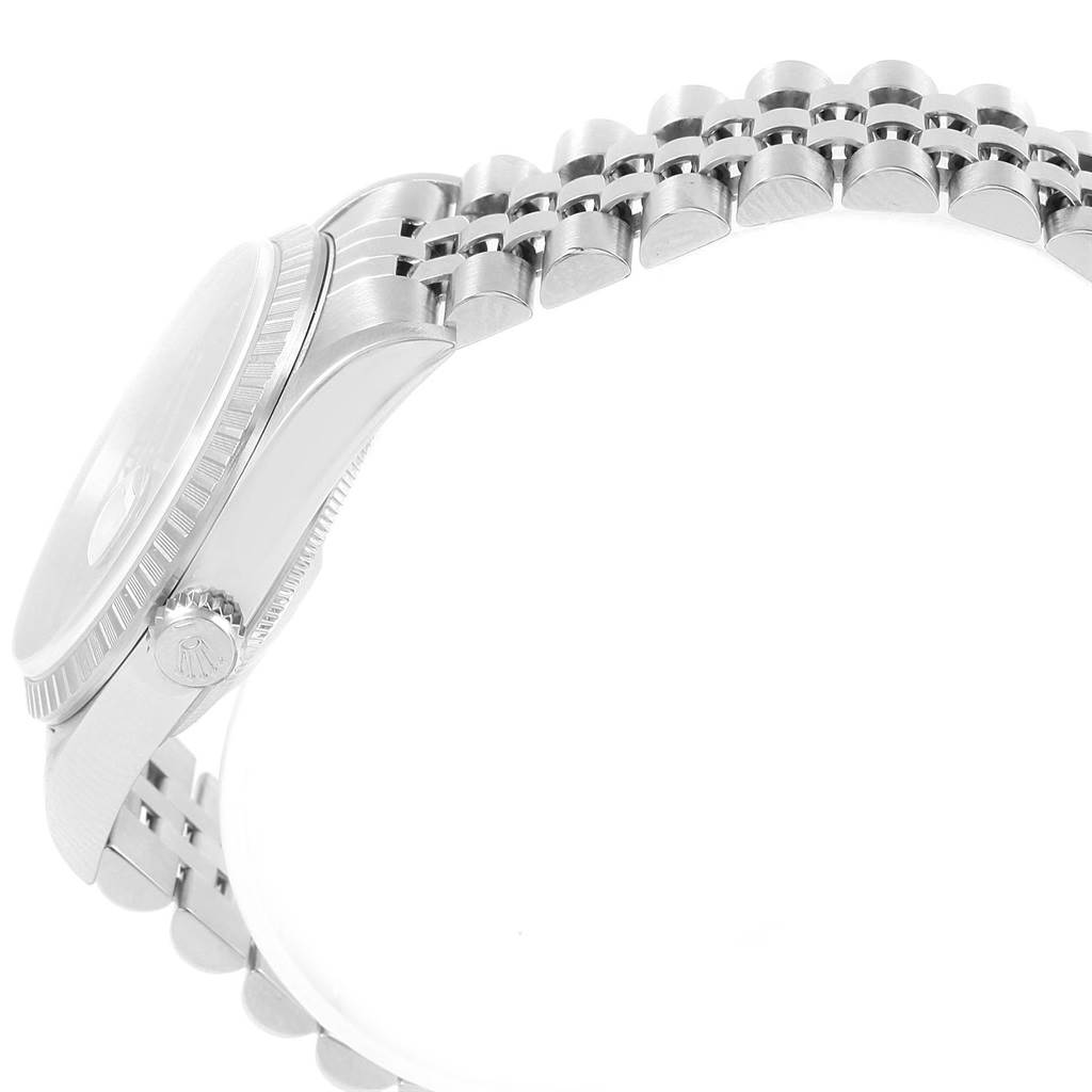 The image shows a side view of a Rolex Datejust 16220 Men's Stainless Steel Pink Dial 16220 Men's Stainless Steel Pink Dial watch, highlighting the case, crown, bezel, and part of the bracelet.