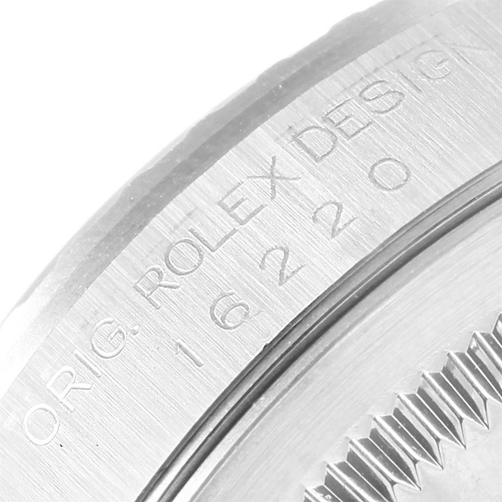 The image shows a close-up angle of the case back engraving on a Rolex Datejust 16220 Men's Stainless Steel Pink Dial 16220 Men's Stainless Steel Pink Dial watch.