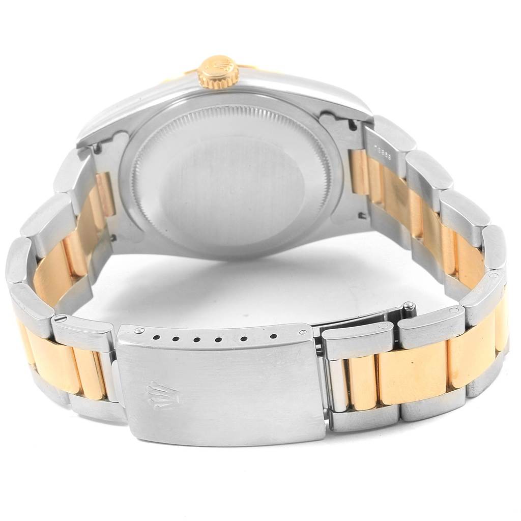 The image shows the back view of a Rolex Datejust 16203 Men
s Steel and Gold (two tone) Blue Dial 16203 Men
s Steel and Gold (two tone) Blue Dial watch, focusing on the case back and two-tone bracelet with clasp.