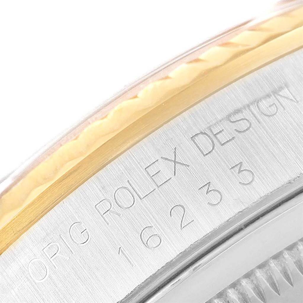 This image shows a close-up of the engraved side of a Rolex Datejust 16233 Men's Steel and Gold (two tone) Champagne Dial 16233 Men's Steel and Gold (two tone) Champagne Dial watch, highlighting the model number "16233" on the case.