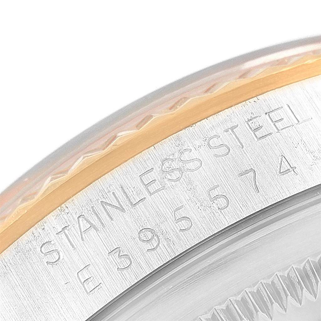 The image shows a close-up of the stainless steel and gold bezel with the serial number on a Rolex Datejust 16233 Men's Steel and Gold (two tone) Champagne Dial 16233 Men's Steel and Gold (two tone) Champagne Dial watch.