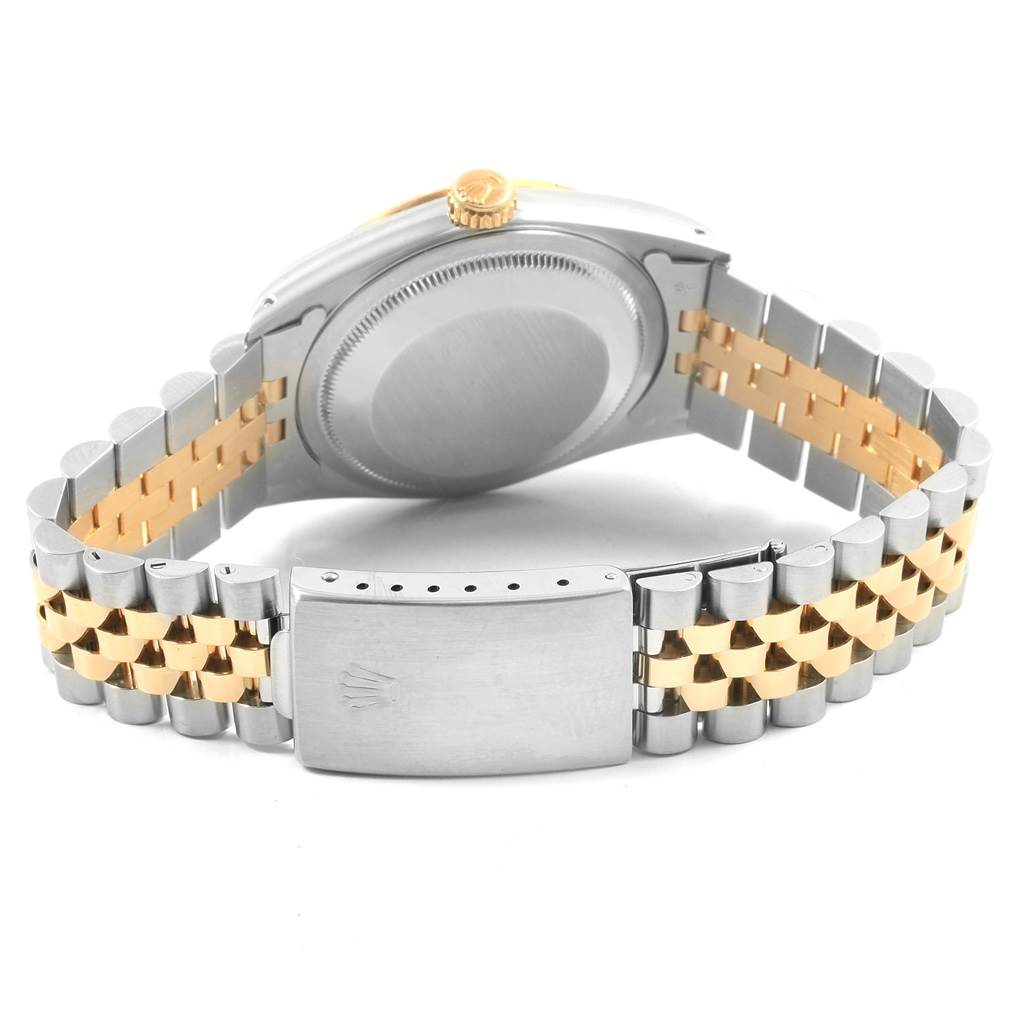 This image shows the back of a Rolex Datejust 16233 Men's Steel and Gold (two tone) Champagne Dial 16233 Men's Steel and Gold (two tone) Champagne Dial watch with its jubilee bracelet and clasp in a partially closed position.