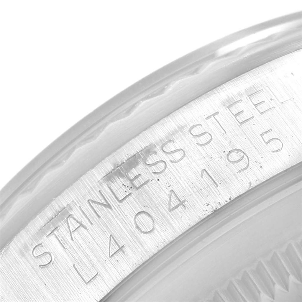 The image shows a close-up angle of the case with a serial number and the text "STAINLESS STEEL" on a Rolex Datejust 16234 Men's Stainless Steel Silver Dial 16234 Men's Stainless Steel Silver Dial watch.