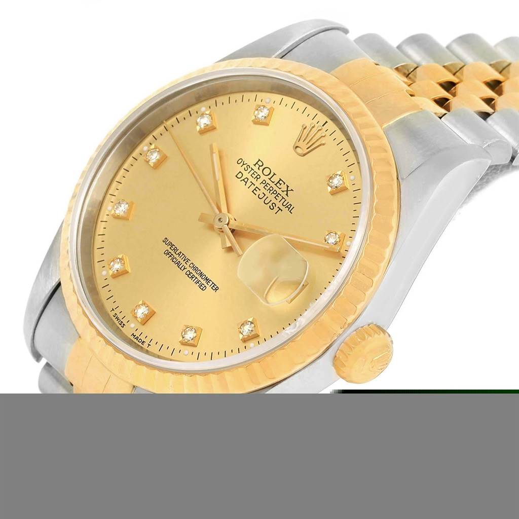This image shows a close-up view of the Rolex Datejust 16233 Men's Steel and Gold (two tone) Champagne Dial 16233 Men's Steel and Gold (two tone) Champagne Dial watch’s face, case, and bracelet at an oblique angle.