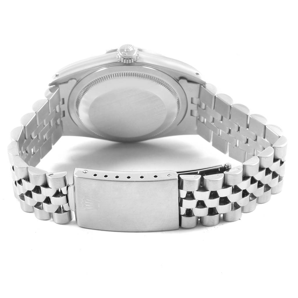 This image shows the back casing, crown, and bracelet clasp of a Rolex Datejust 16234 Men's Stainless Steel Silver Dial 16234 Men's Stainless Steel Silver Dial watch.