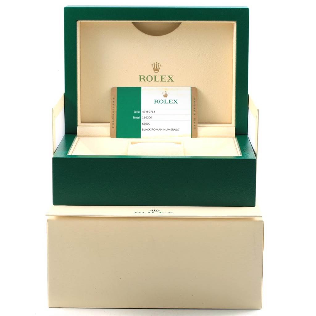 The image shows the open box and warranty card for a Rolex Datejust 116200 Men
s Stainless Steel Black Dial 116200 Men
s Stainless Steel Black Dial watch.