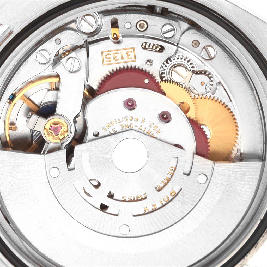 This image shows the internal mechanism of a Rolex Datejust 116203 Men's Stainless Steel Champagne Dial 116203 Men's Stainless Steel Champagne Dial watch, highlighting the gears and intricate components.