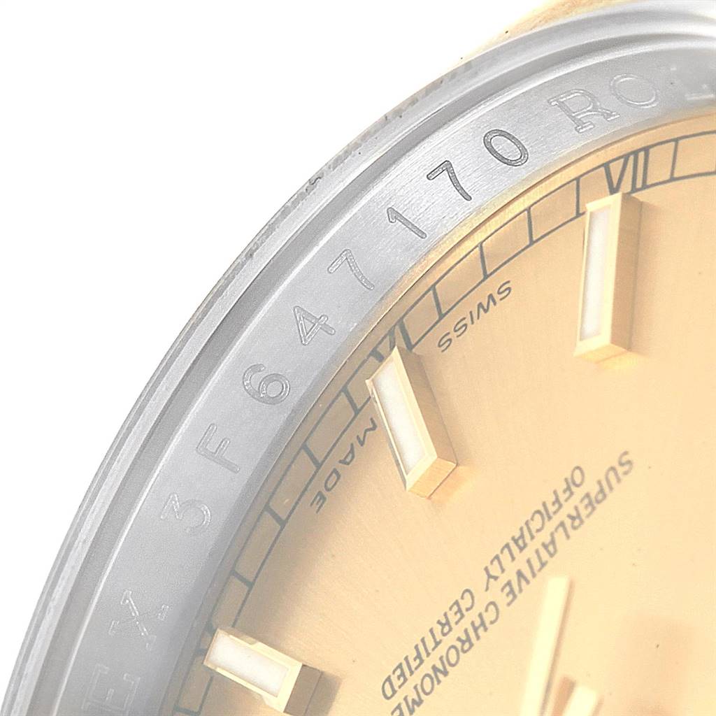 This image shows a close-up of the dial and part of the bezel of a Rolex Datejust 116203 Men's Stainless Steel Champagne Dial 116203 Men's Stainless Steel Champagne Dial watch, focusing on the serial number and dial details.