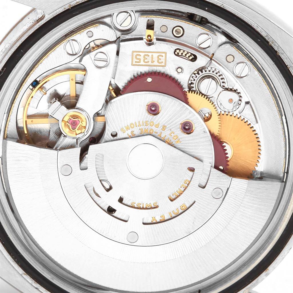 This image shows the intricate inner workings and mechanical parts of a Rolex Datejust 116234 Men
s Stainless Steel White Dial 116234 Men
s Stainless Steel White Dial watch from a rear angle.