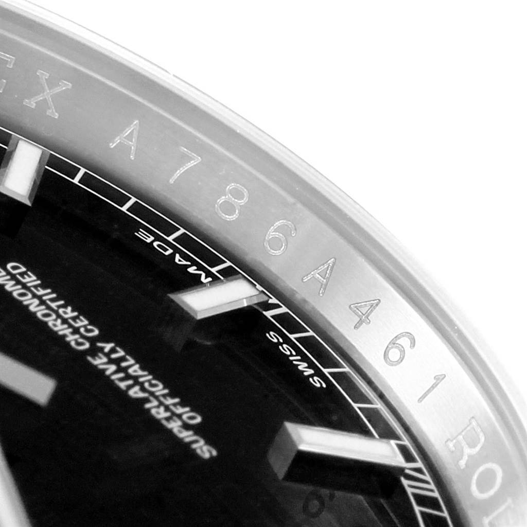 The image shows a close-up angle of the bezel, partial dial, and serial number on a Rolex Datejust 116234 Men
s Stainless Steel Black Dial 116234 Men
s Stainless Steel Black Dial watch.