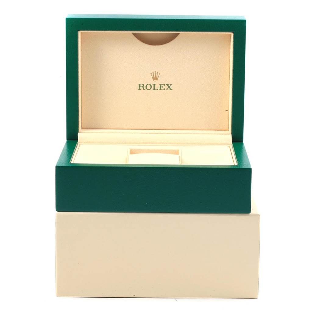 This image shows an open green and beige box for a Rolex Datejust 116234 Men
s Stainless Steel Black Dial 116234 Men
s Stainless Steel Black Dial watch, displaying its interior compartments.