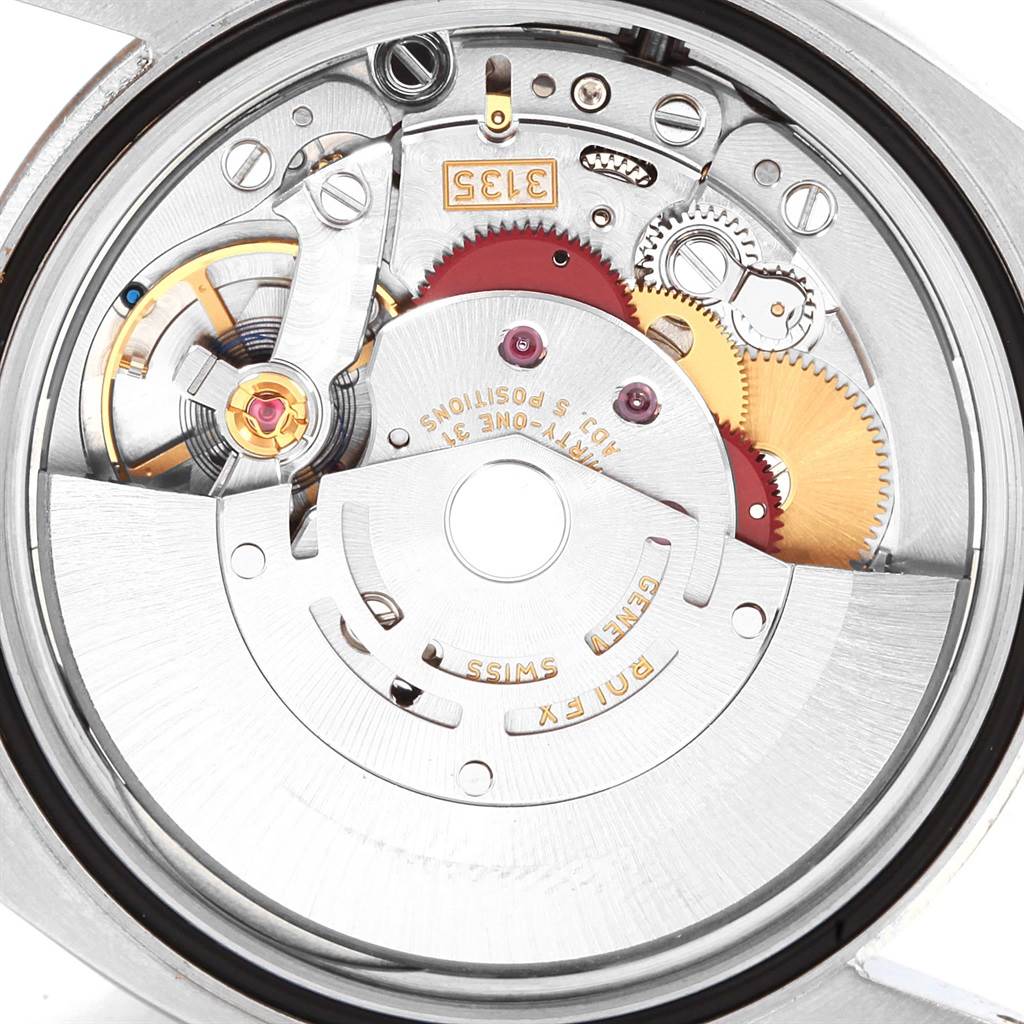 This image shows the internal mechanism of a Rolex Datejust 116234 Men
s Stainless Steel Black Dial 116234 Men
s Stainless Steel Black Dial watch, highlighting its intricate gears and movement components.