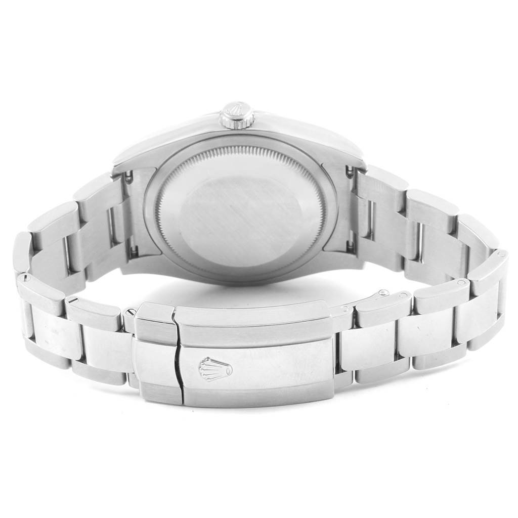 The image shows the back view of a Rolex Datejust 116234 Men
s Stainless Steel Black Dial 116234 Men
s Stainless Steel Black Dial, focusing on its case back and metal bracelet clasp.