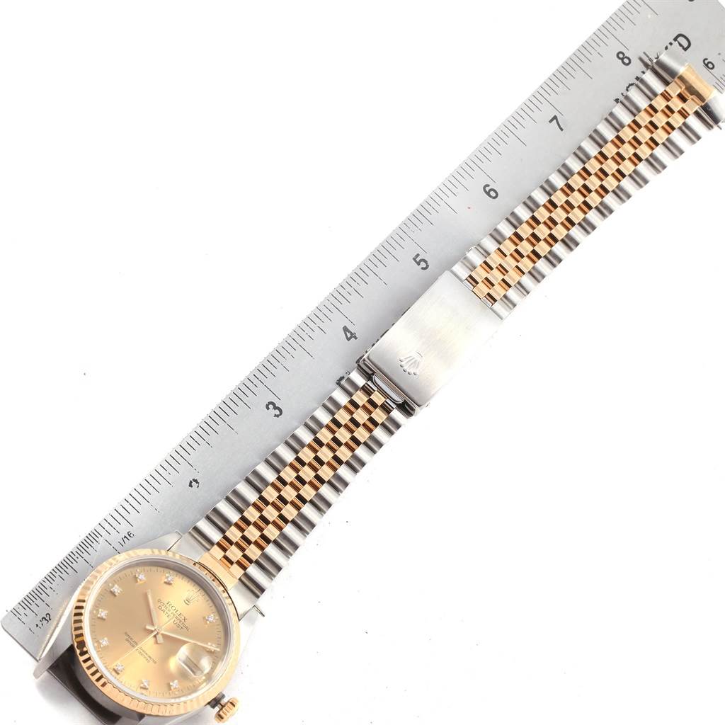The image shows the Rolex Datejust 16233 Men's Steel and Gold (two tone) Champagne Dial 16233 Men's Steel and Gold (two tone) Champagne Dial watch laid flat with its dial, bracelet, and clasp, measured against a ruler.