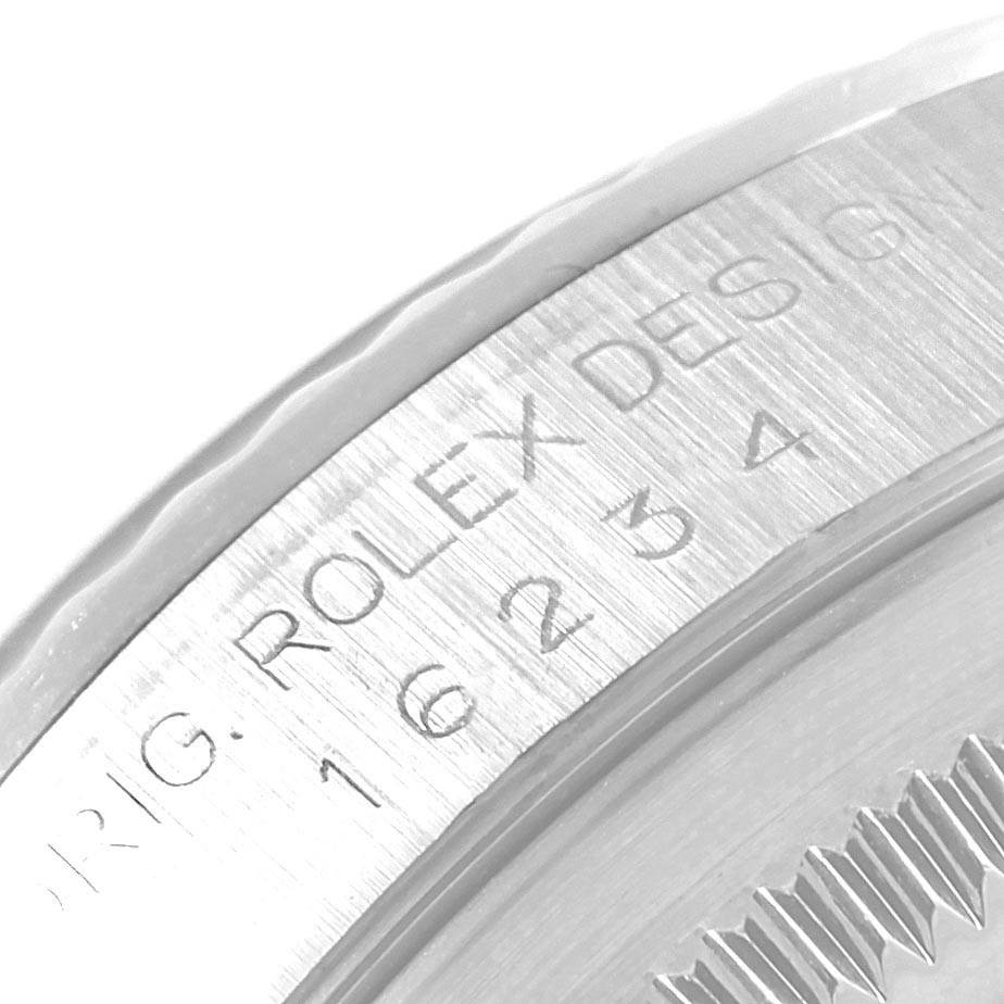 The image shows a close-up of the engraved reference number and branding on the side of a Rolex Datejust 16234 Men
s Stainless Steel Silver Dial 16234 Men
s Stainless Steel Silver Dial watch.