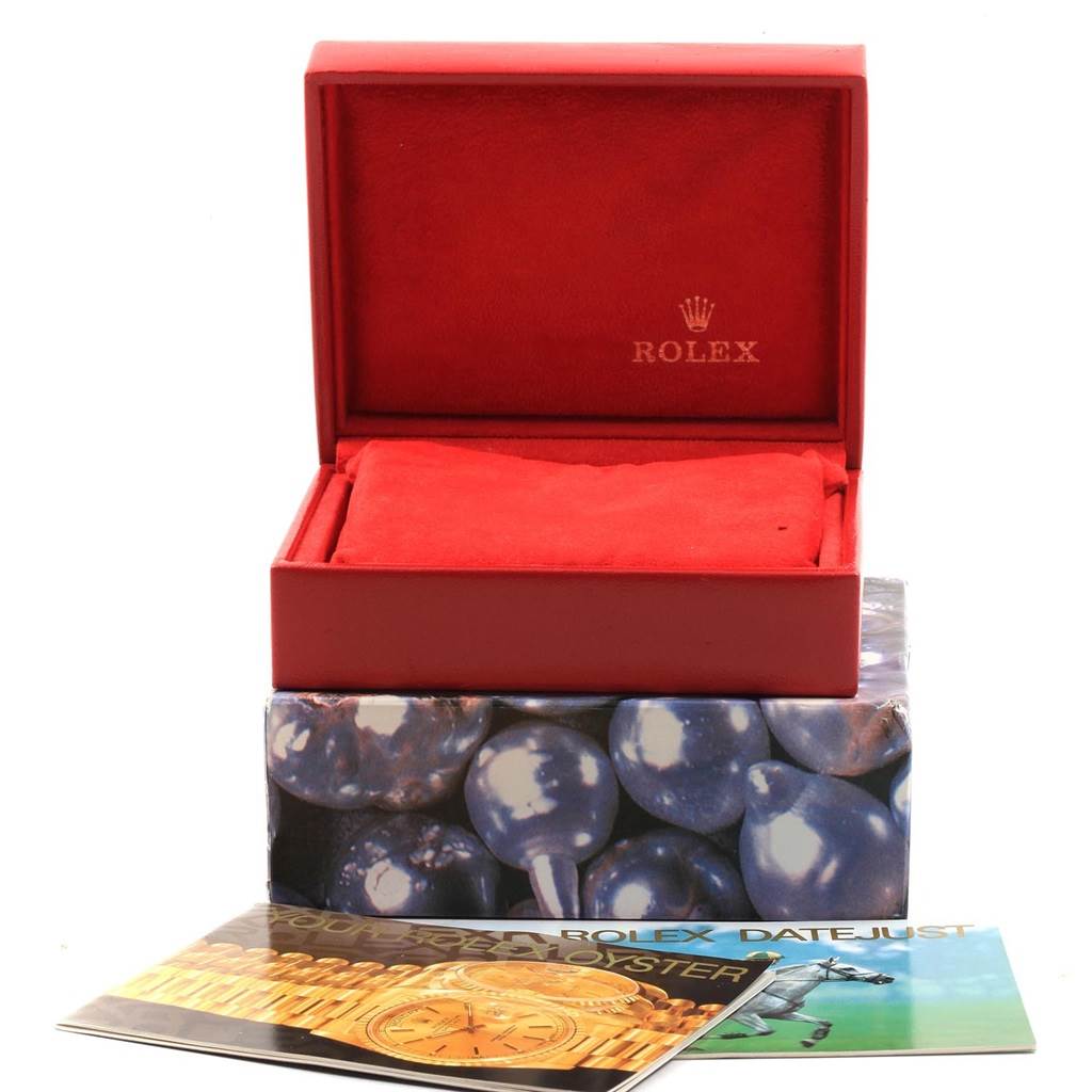 The image shows an open Rolex Datejust 16234 Men
s Stainless Steel Silver Dial 16234 Men
s Stainless Steel Silver Dial watch box and accompanying booklets from a front-facing angle.