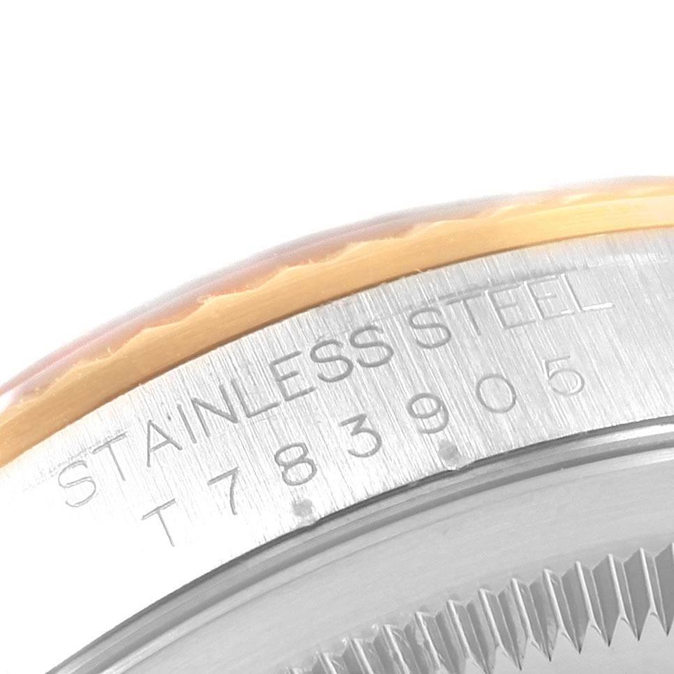 The image shows a close-up of the side of the bezel and case of a Rolex Datejust 16233 Men's Steel and Gold (two tone) Champagne Dial 16233 Men's Steel and Gold (two tone) Champagne Dial watch, with "STAINLESS STEEL" engraved.