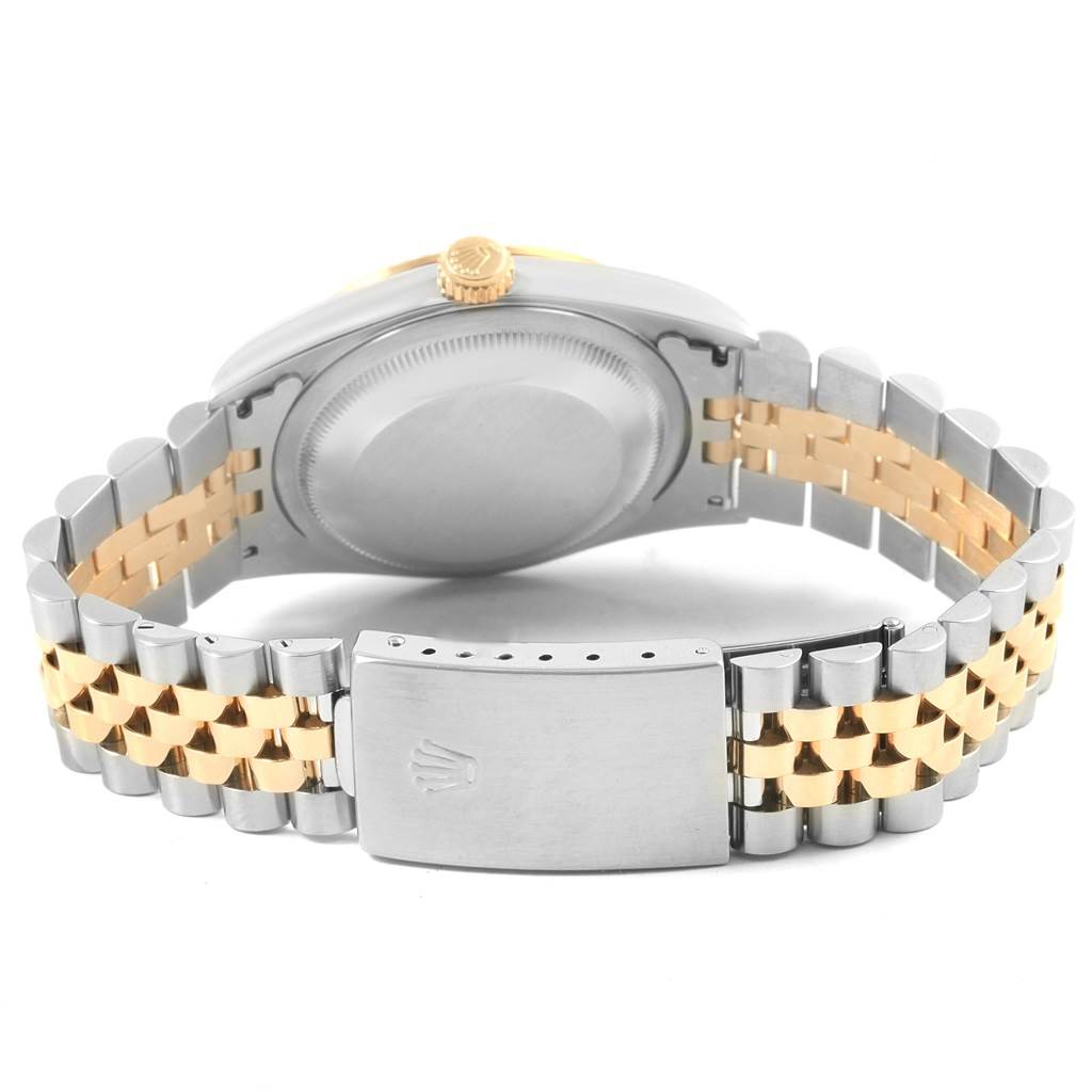 The image shows the back view of a Rolex Datejust 16233 Men's Steel and Gold (two tone) Champagne Dial 16233 Men's Steel and Gold (two tone) Champagne Dial watch, displaying its bracelet, clasp, and case back.