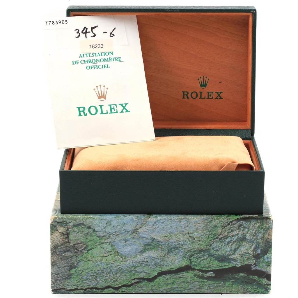 This image shows the packaging and documentation of a Rolex Datejust 16233 Men's Steel and Gold (two tone) Champagne Dial 16233 Men's Steel and Gold (two tone) Champagne Dial model watch, including the box and a certificate.