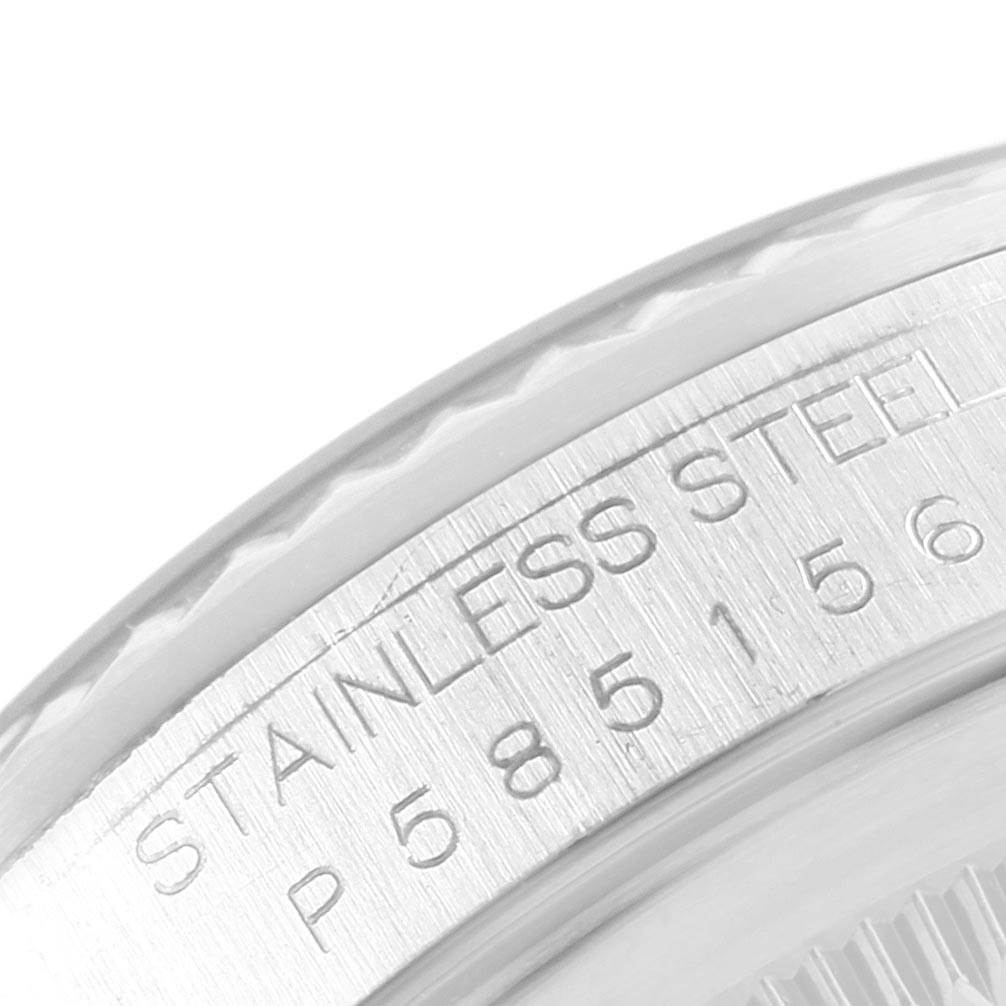 The image shows a close-up of the engraved case back edge of the Rolex Datejust 16234 Men's Stainless Steel Silver Dial 16234 Men's Stainless Steel Silver Dial watch in stainless steel.