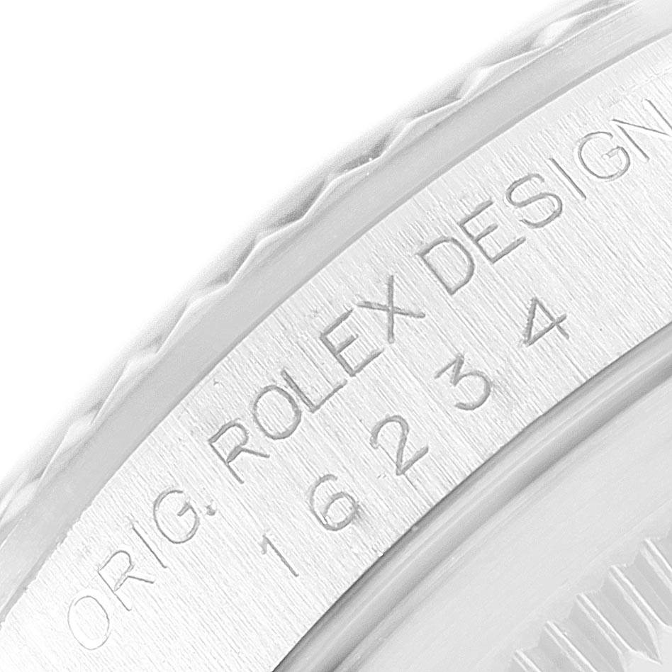 This image shows a close-up of the engraved case side of a Rolex Datejust 16234 Men's Stainless Steel Silver Dial 16234 Men's Stainless Steel Silver Dial watch.