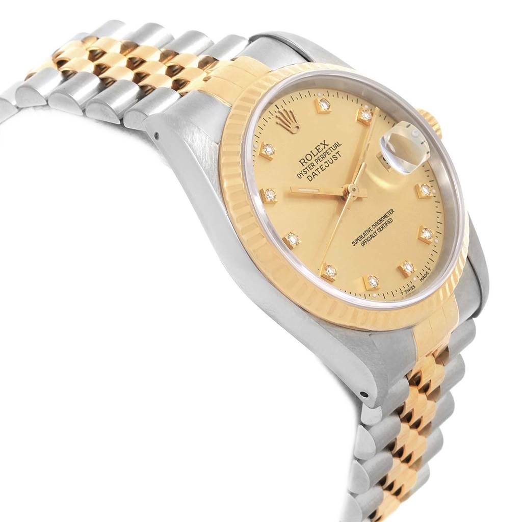 The image shows a side angle of a Rolex Datejust 16233 Men's Steel and Gold (two tone) Champagne Dial 16233 Men's Steel and Gold (two tone) Champagne Dial watch highlighting the gold dial, fluted bezel, and the two-tone bracelet.
