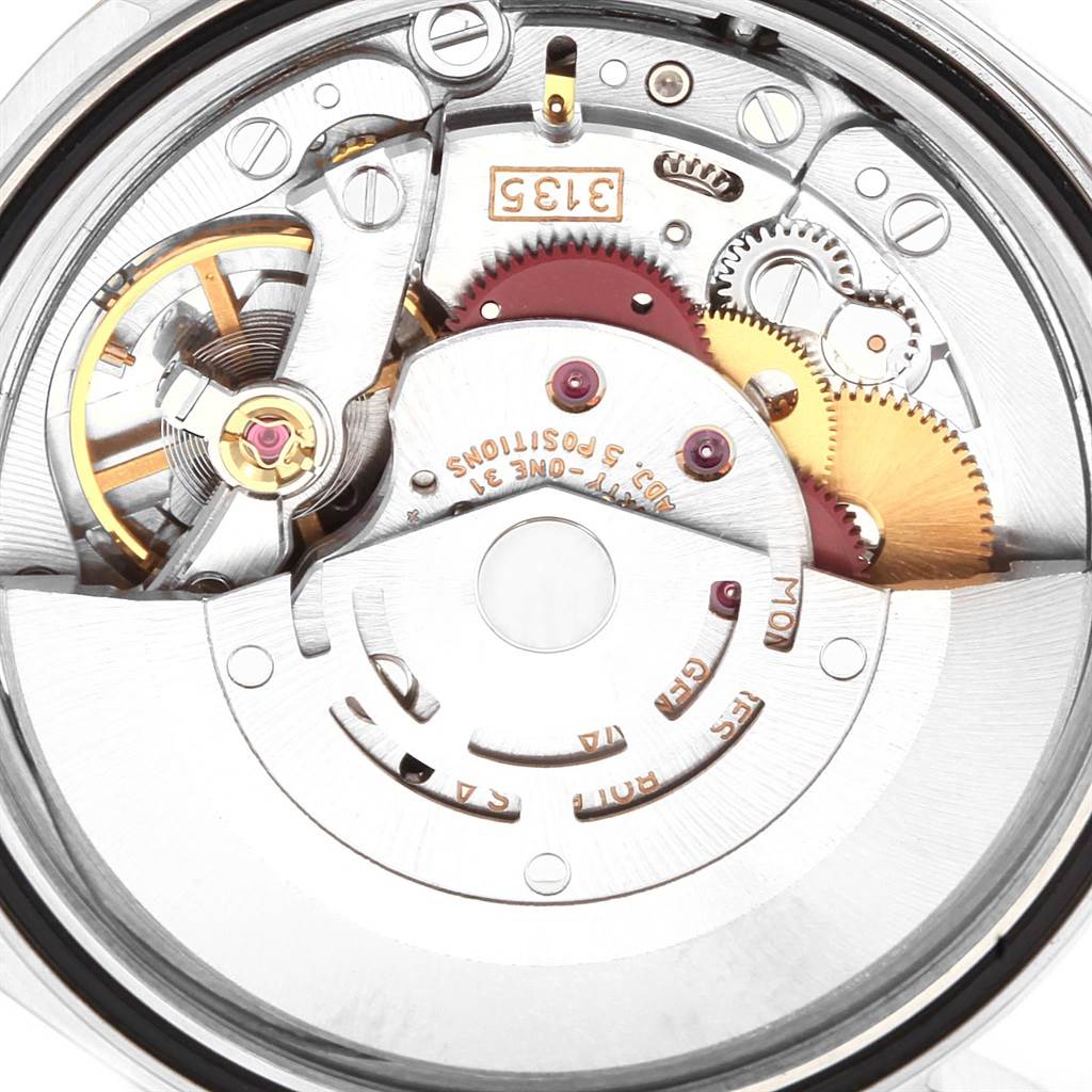 This image shows a close-up view of the movement inside a Rolex Datejust 16233 Men's Steel and Gold (two tone) Champagne Dial 16233 Men's Steel and Gold (two tone) Champagne Dial watch, highlighting the gears and mechanisms.