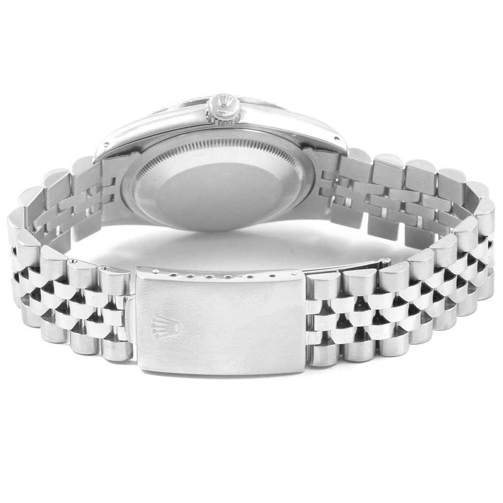 The image shows the back view of a Rolex Datejust 16234 Men
s Stainless Steel Silver Dial 16234 Men
s Stainless Steel Silver Dial watch, highlighting its case back, crown, and metal bracelet clasp.