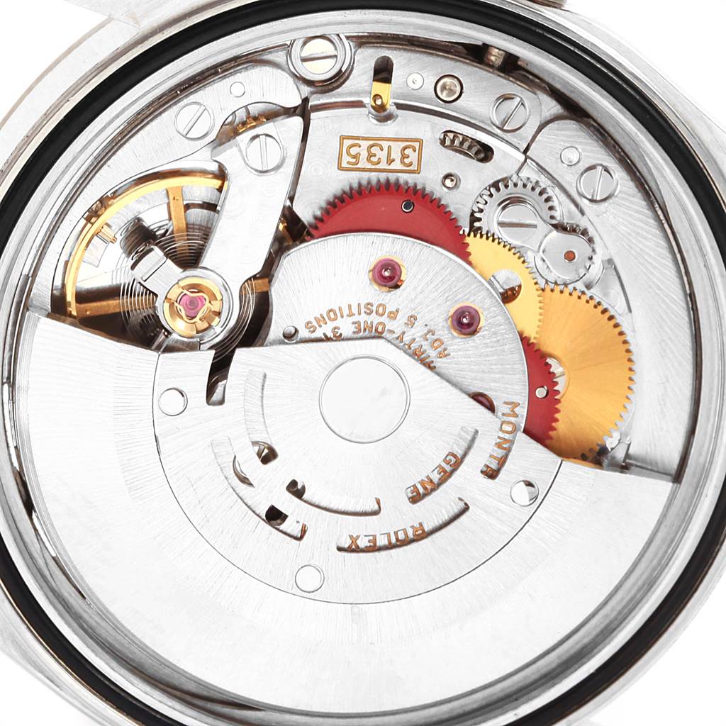 This close-up image shows the intricate internal movement of a Rolex Datejust 16234 Men
s Stainless Steel Silver Dial 16234 Men
s Stainless Steel Silver Dial watch, highlighting its gears and mechanical components.