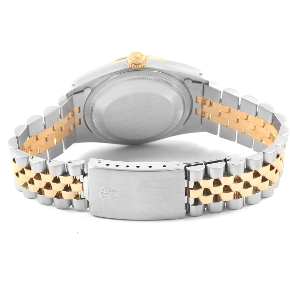 The image shows the back case and bracelet of a Rolex Datejust 16233 Men's Steel and Gold (two tone) White Dial 16233 Men's Steel and Gold (two tone) White Dial watch, featuring a two-tone design in silver and gold.